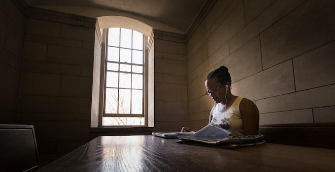 Student studies at a table in one of the many Cathedral of Learning alcoves. 